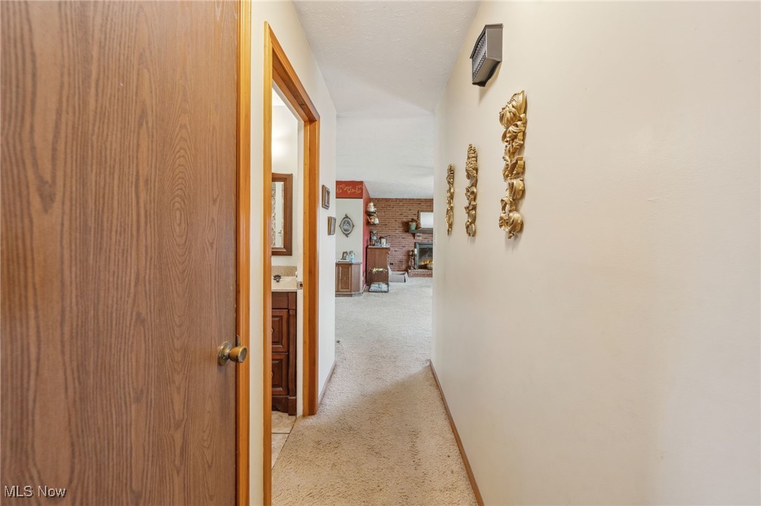4790 Paradise Road Seville, OH 44273 - Photo 34 of 45 Hall with light colored carpet and baseboards