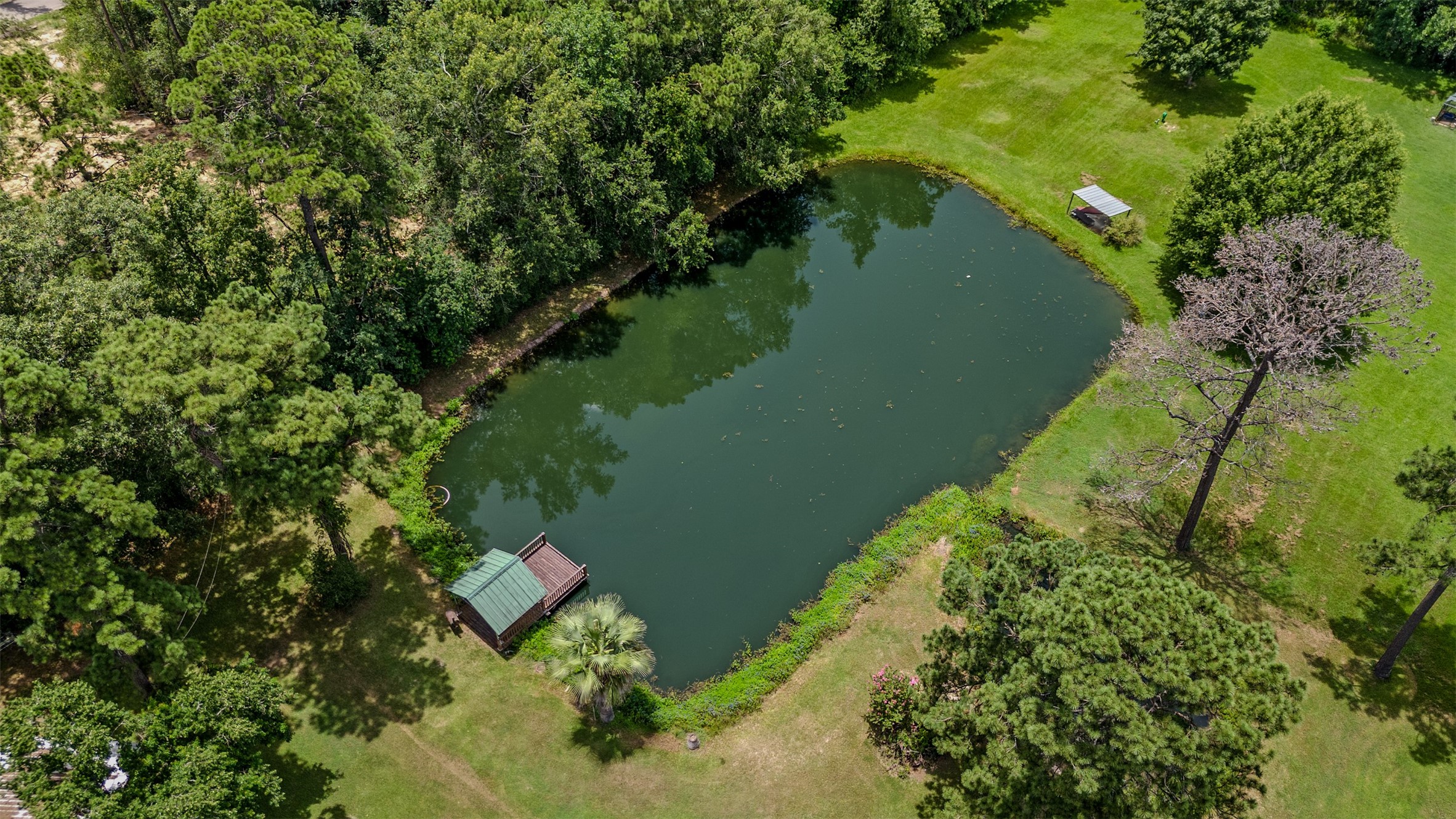 11692 Clark Lane Conroe, TX 77385 - Photo 30 of 35 Aerial view of the shared pond.