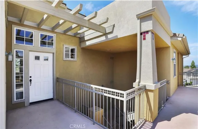 a view of a porch with wooden floor and stairs