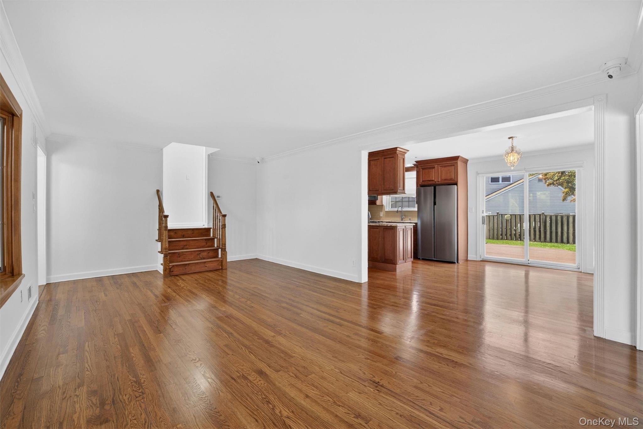 263 Croydon Road Yonkers, NY 10710 - Photo 5 of 43 a view of empty room with wooden floor and fireplace