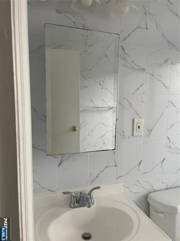 a bathroom with a sink and a toilet