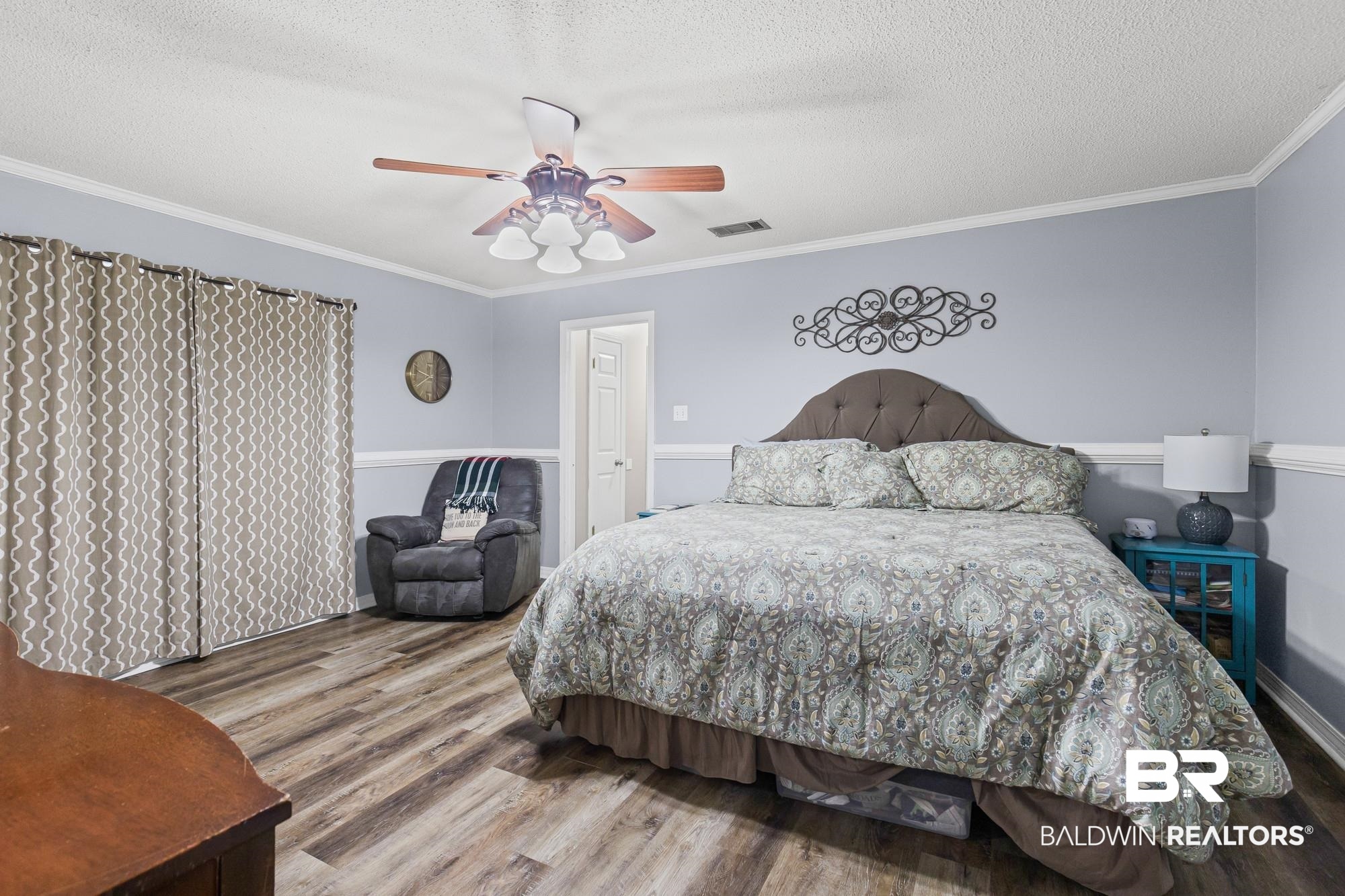 6609 Blakeley Court Mobile, AL 36695 - Photo 20 of 28 Bedroom with crown molding, wood finished floors, a textured ceiling, and ceiling fan