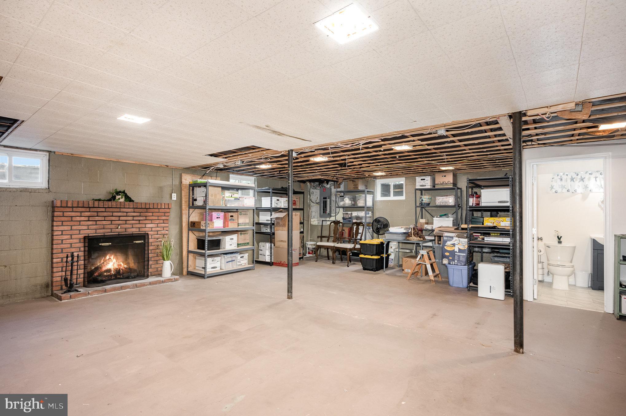 81 George Street Taneytown, MD 21787 - Photo 22 of 30 Partially Finished Basement With Fireplace