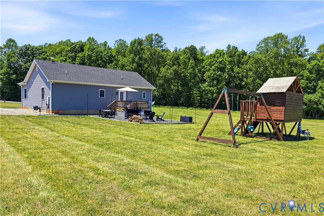 235 Stoney Point Road Cumberland, VA 23040 - Photo 10 of 35 a view of a house with backyard and a slide