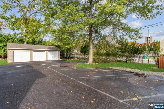 a view of a house with a outdoor space and a tree
