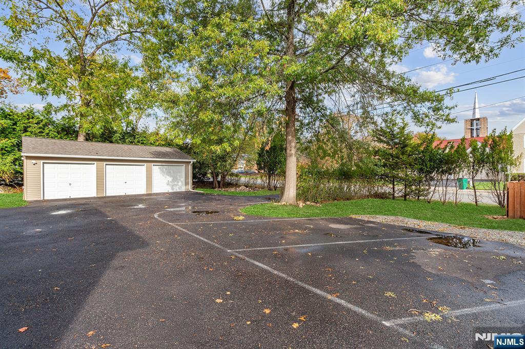 36 Pascack Road, Unit 2 Park Ridge, NJ 07656 - Photo 21 of 22 a view of a house with a outdoor space and a tree