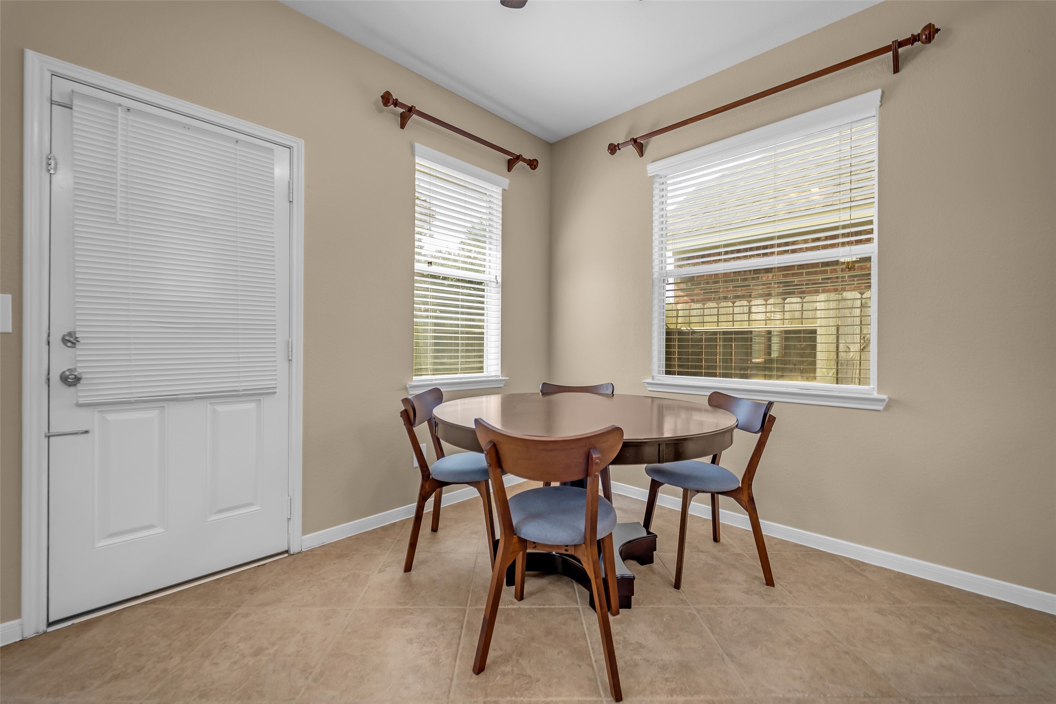 5406 Quarry Ridge Road Richmond, TX 77407 - Photo 11 of 36 Sunlit breakfast area with backyard views, creating an inviting space for everyday meals and morning coffee.