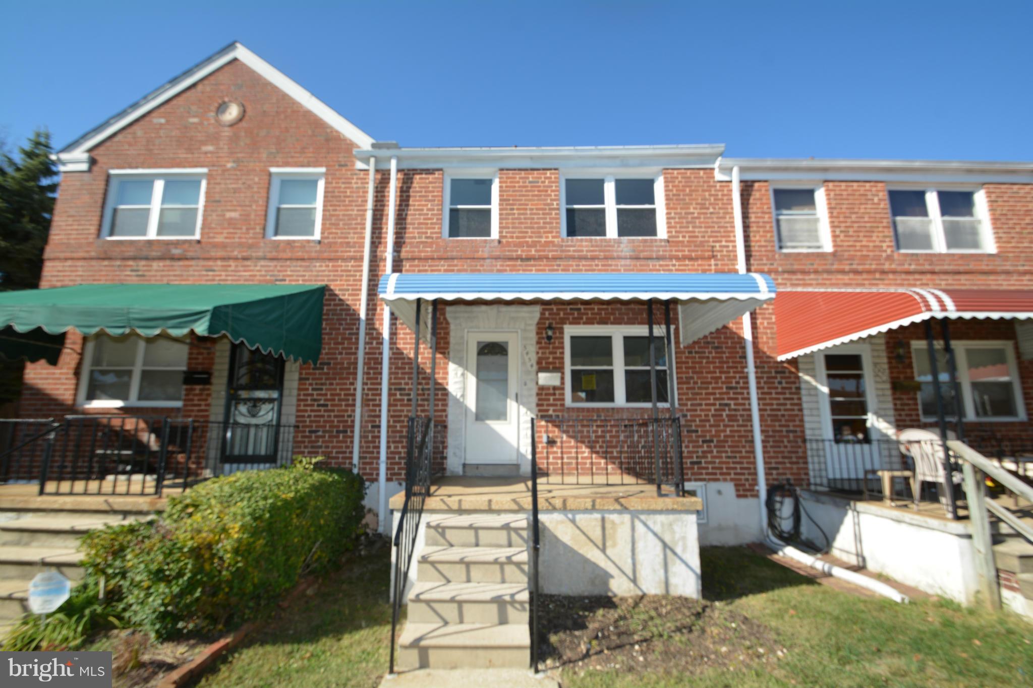 5454 Whitlock Road Baltimore, MD 21229 - Photo 1 of 30 front view of house with a yard