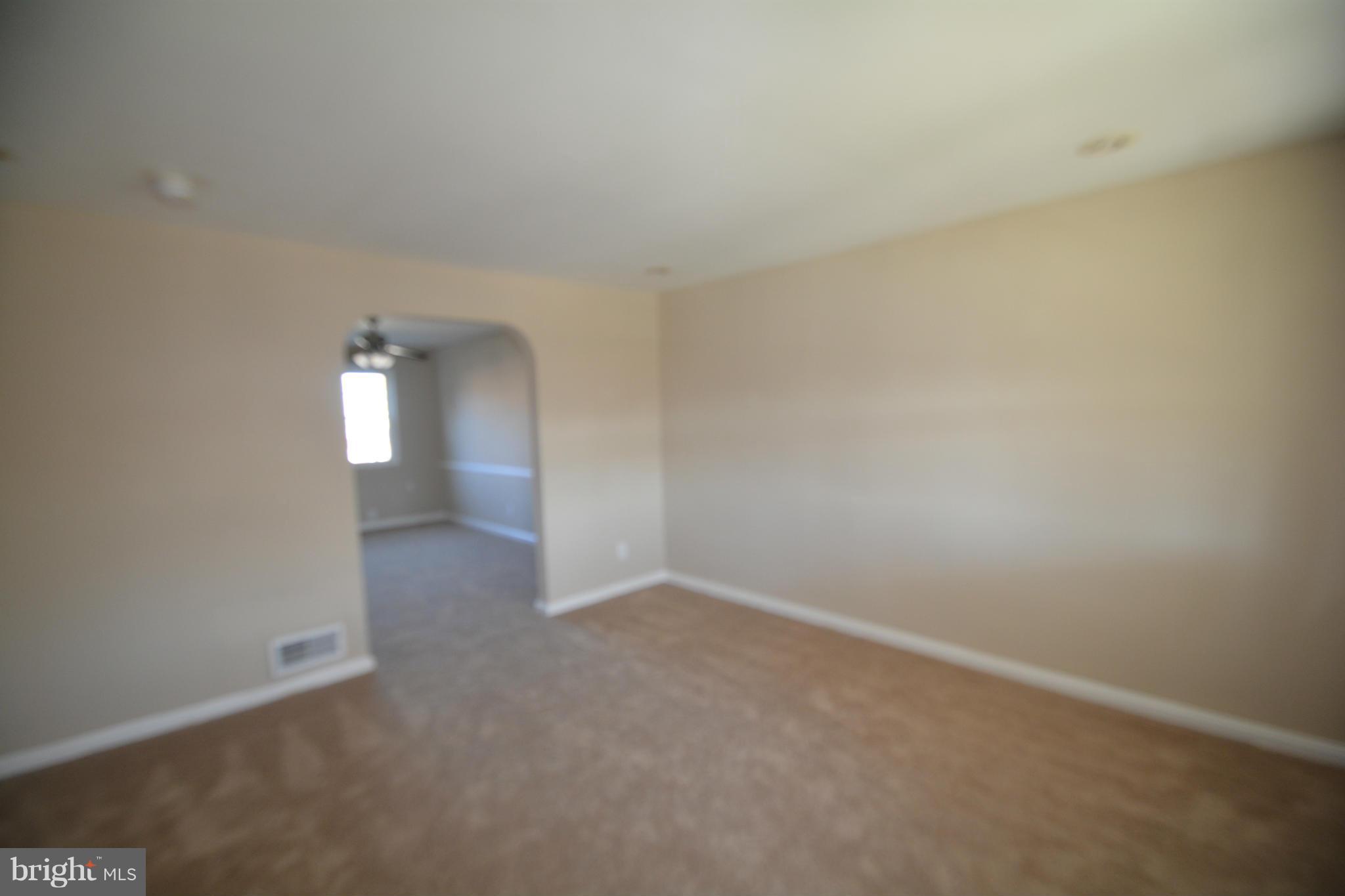 5454 Whitlock Road Baltimore, MD 21229 - Photo 18 of 30 wooden floor in an empty room