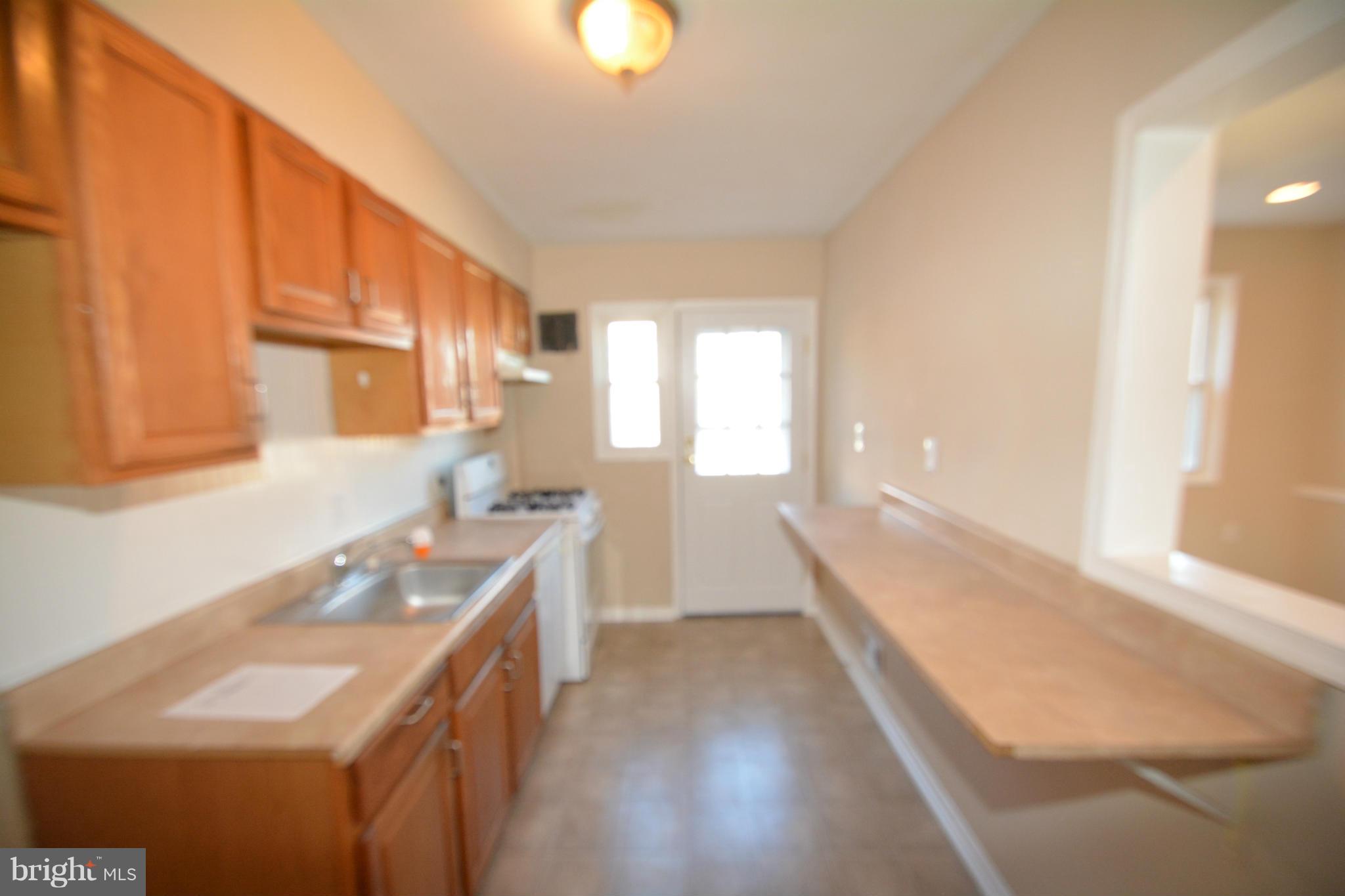 5454 Whitlock Road Baltimore, MD 21229 - Photo 22 of 30 a kitchen with a sink and a window