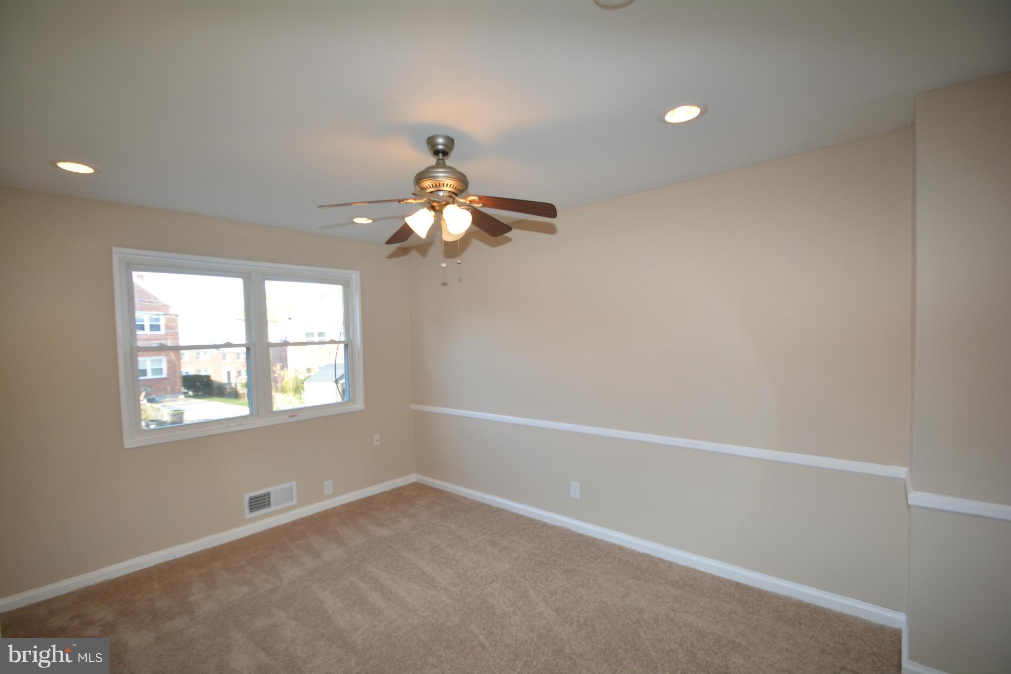 5454 Whitlock Road Baltimore, MD 21229 - Photo 5 of 30 an empty room with a window