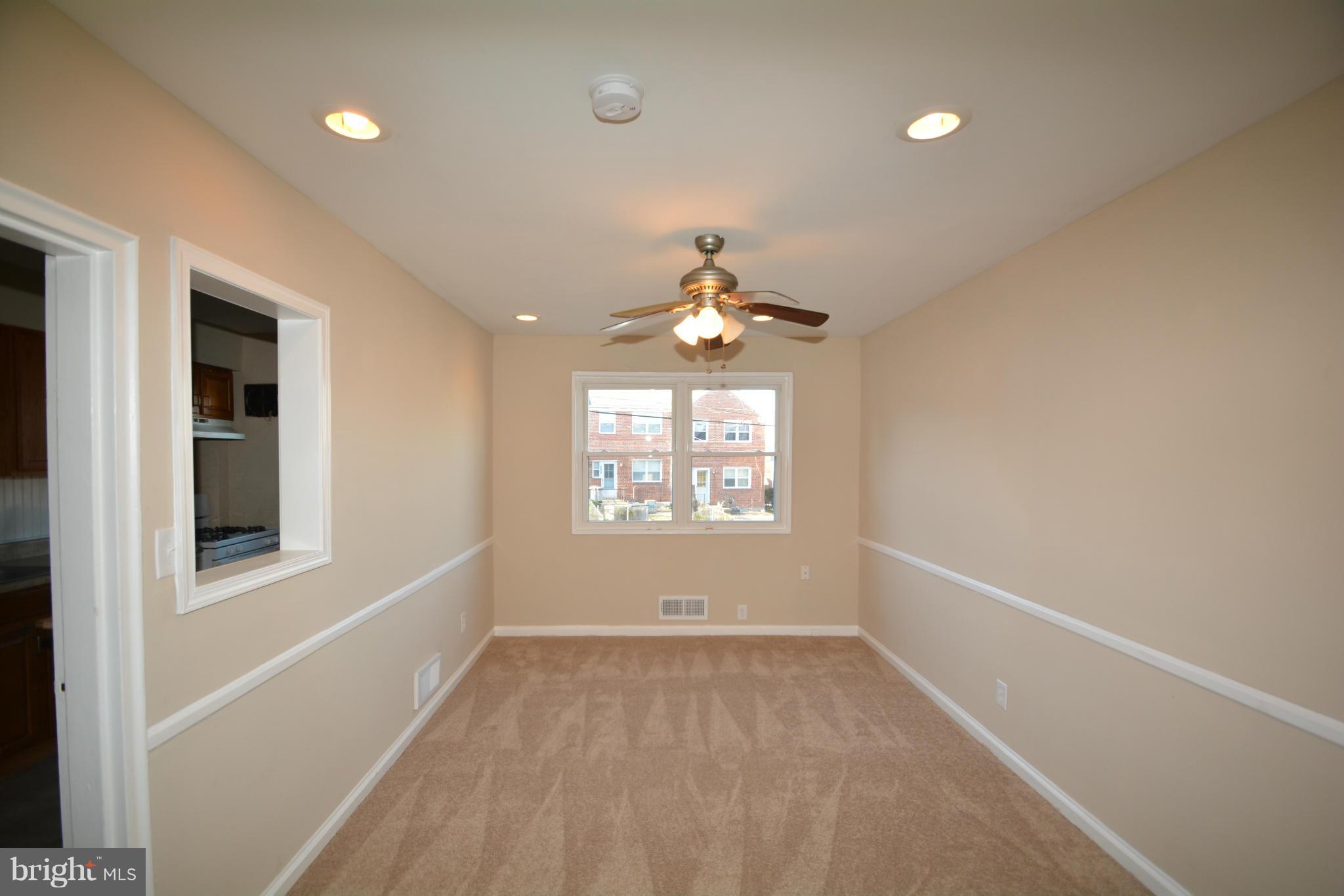 5454 Whitlock Road Baltimore, MD 21229 - Photo 7 of 30 a view of an empty room with a window