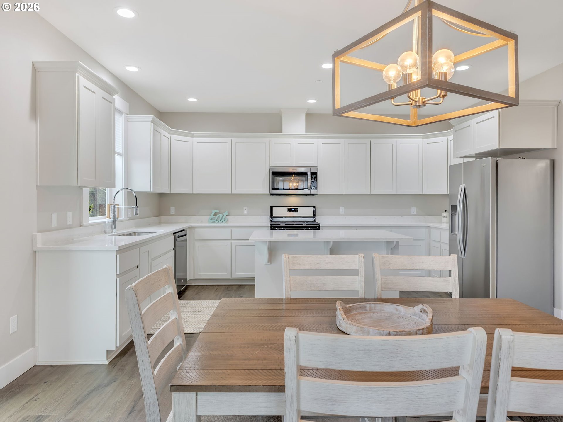 2188 Stanley Lake Court Seaside, OR 97138 - Photo 12 of 46 a kitchen with stainless steel appliances granite countertop a stove a sink and a refrigerator
