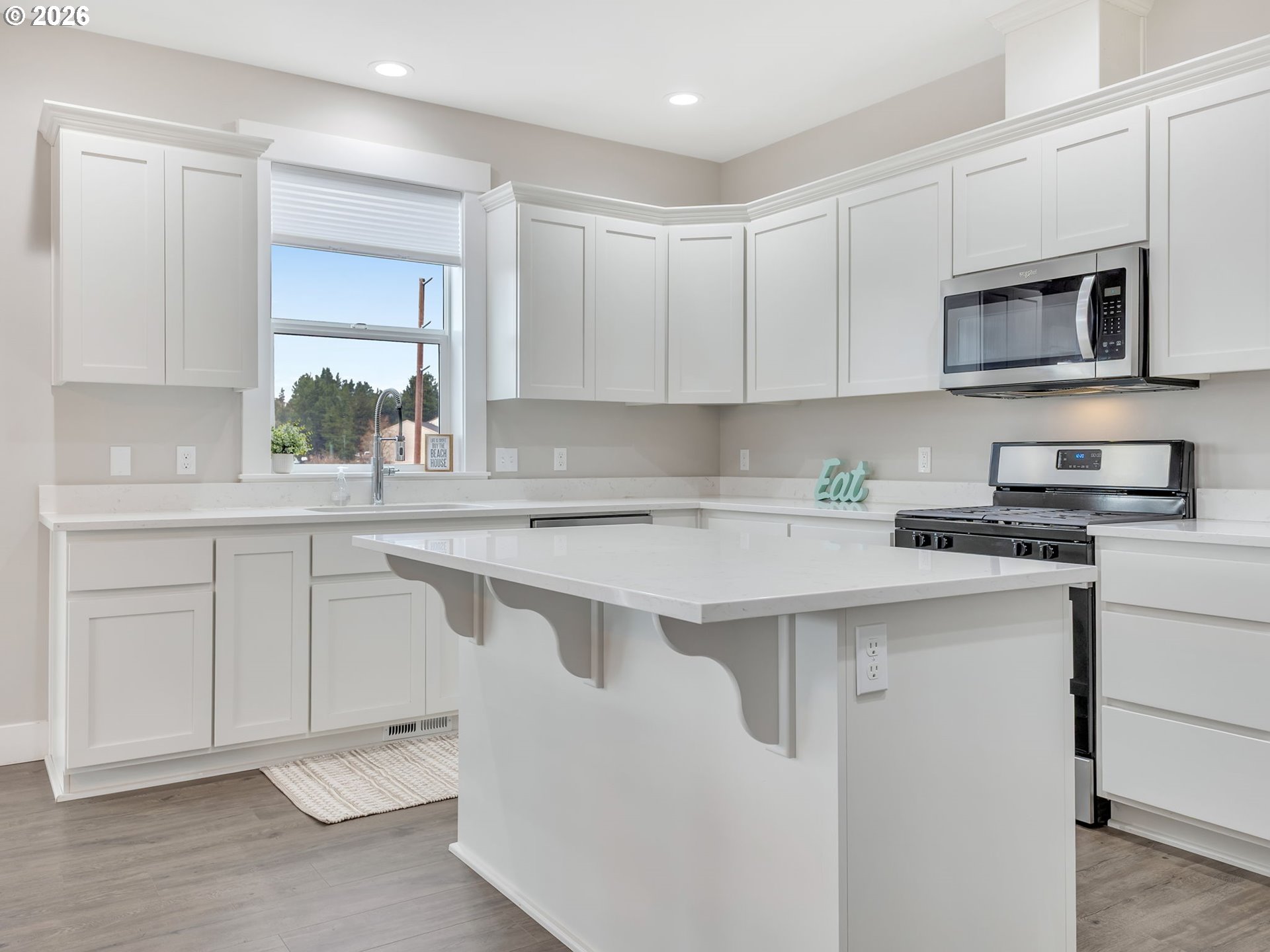 2188 Stanley Lake Court Seaside, OR 97138 - Photo 15 of 46 a kitchen with cabinets appliances a sink and a counter top space