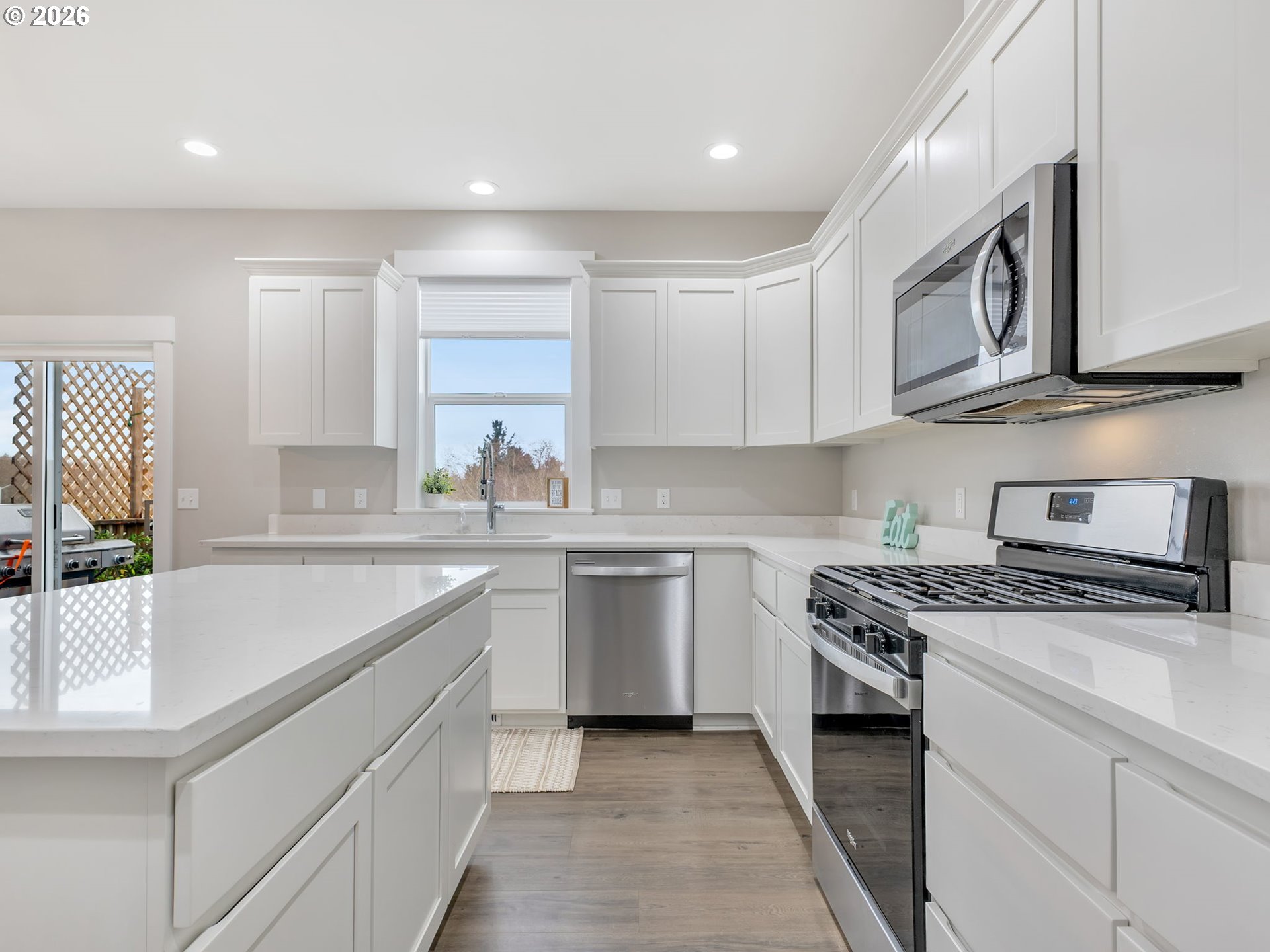 2188 Stanley Lake Court Seaside, OR 97138 - Photo 16 of 46 a kitchen with stainless steel appliances granite countertop a sink and a stove