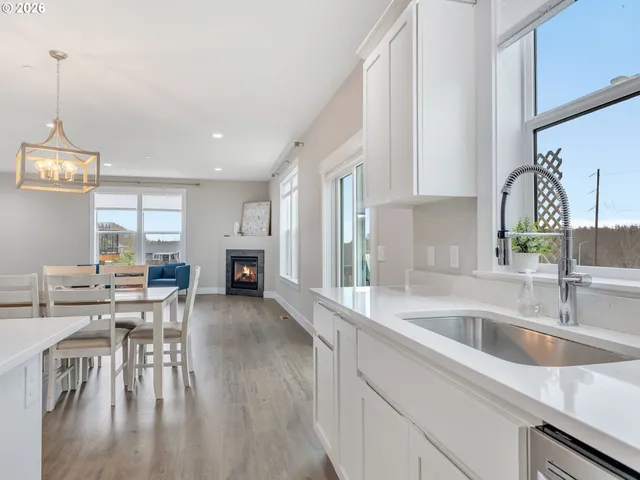 a kitchen with sink cabinets and dining table