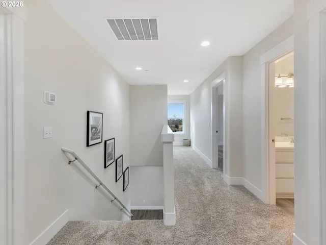 a view of a hallway with staircase
