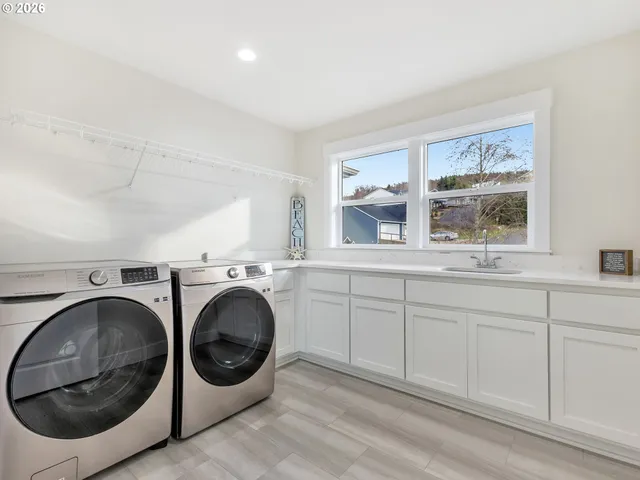 a utility room with dryer and washer