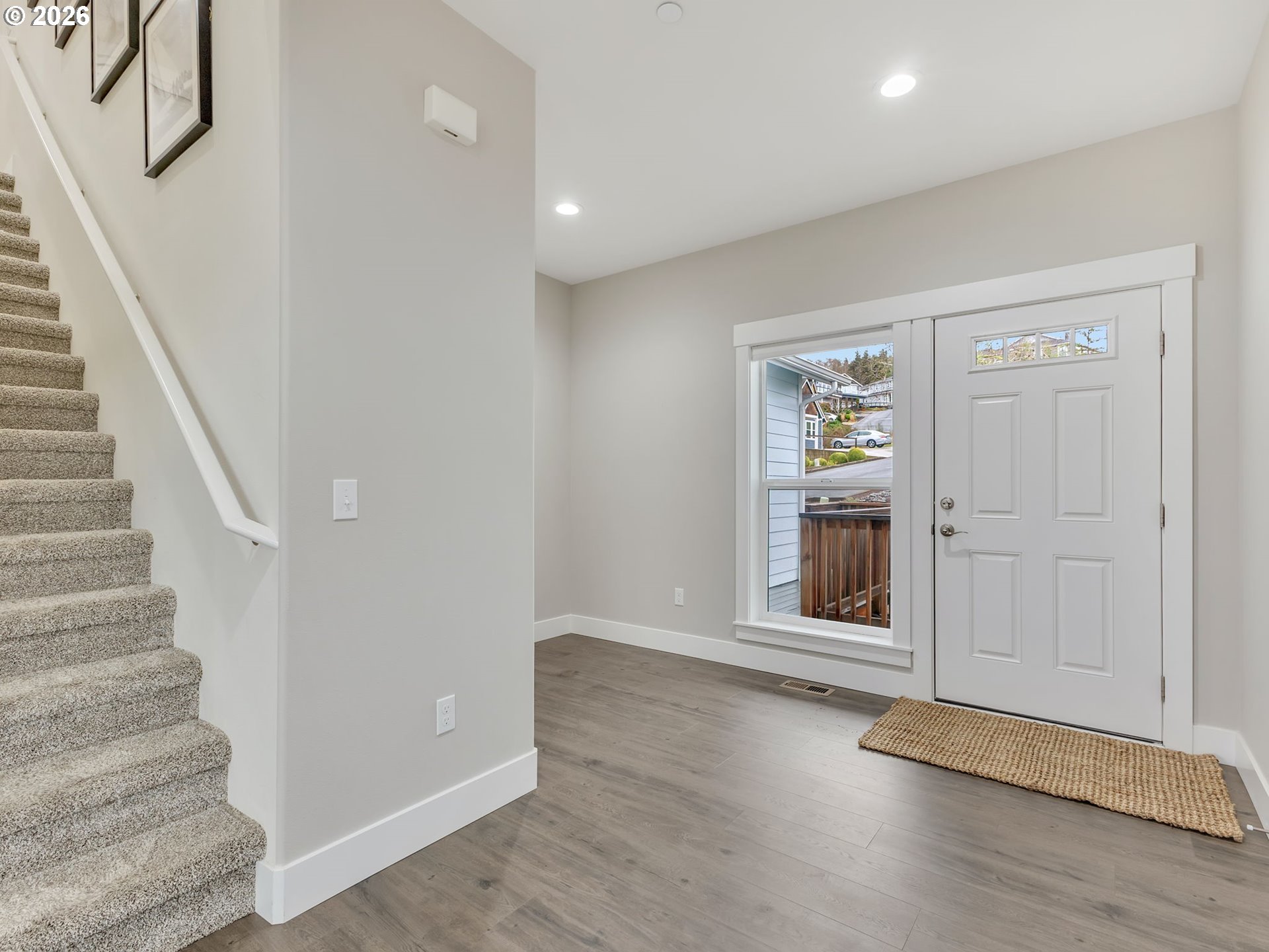 2188 Stanley Lake Court Seaside, OR 97138 - Photo 4 of 46 a view of an entryway with wooden floor and door