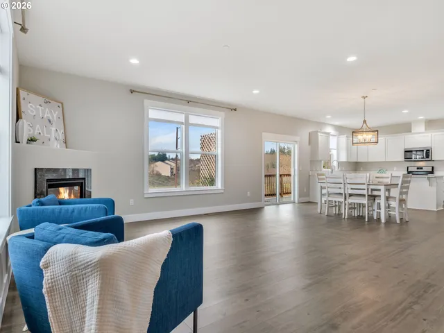 a living room with furniture and kitchen view