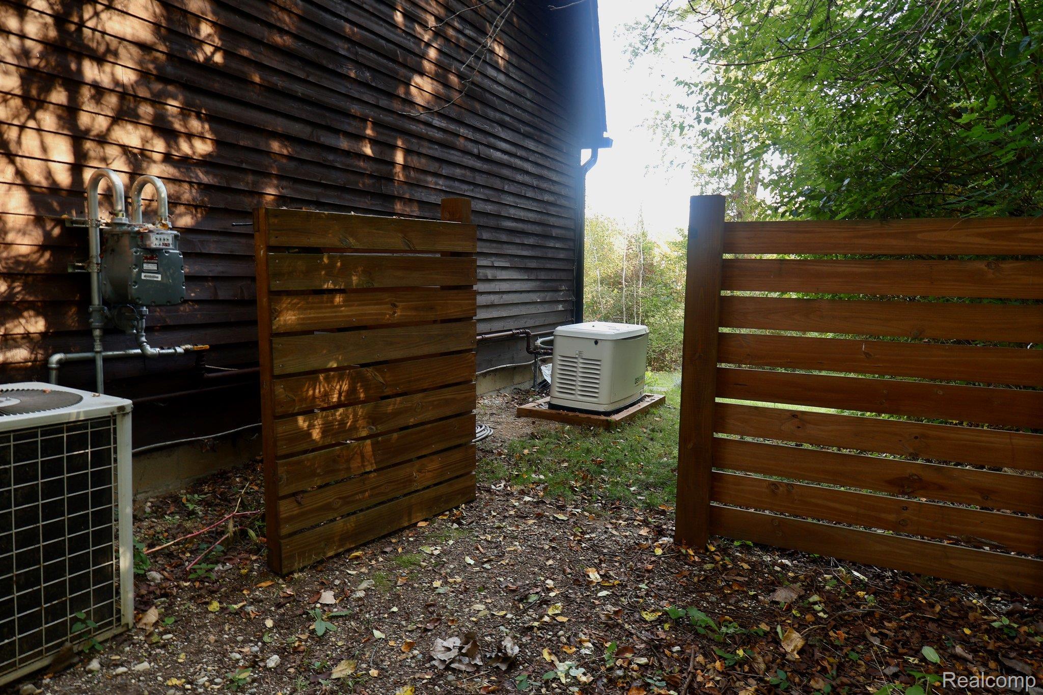 8312 Whitmore Lake Road Brighton, MI 48116 - Photo 41 of 43 Wood-slat privacy fence