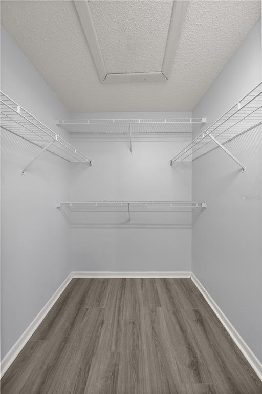 10441 Southwest 85th Court Ocala, FL 34481 - Photo 13 of 32 a view of a room with empty racks