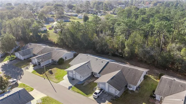 an aerial view of residential house with outdoor space and swimming pool
