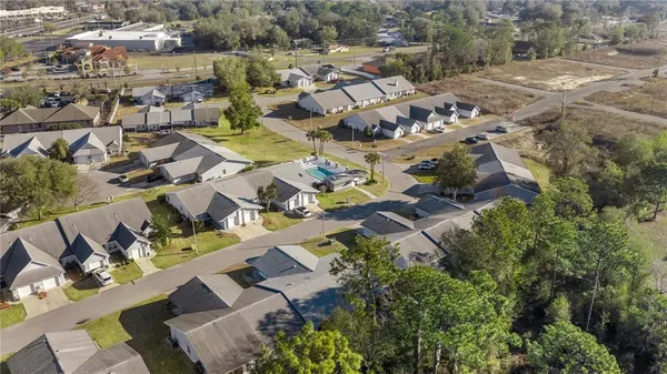 an aerial view of a house with a lake view