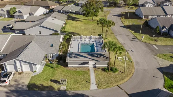 an aerial view of a house with outdoor space