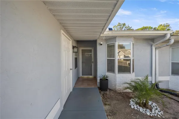 a view of a house with door and porch