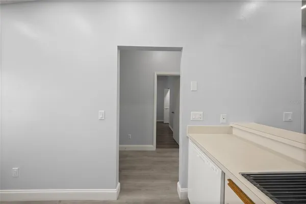 a view of a kitchen cabinets and wooden floor