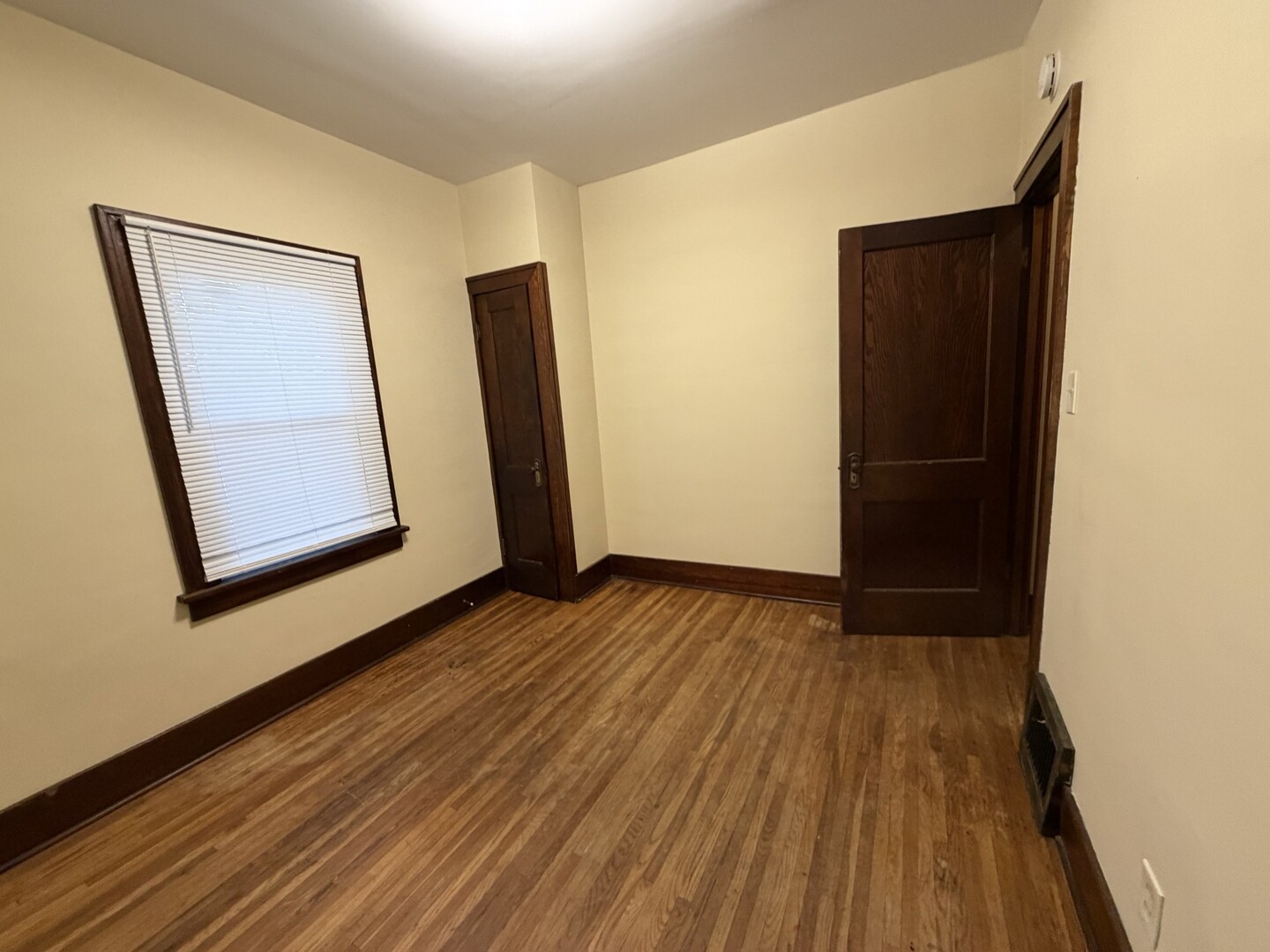 705 West Olive Street Bloomington, IL 61701 - Photo 18 of 32 a view of an empty room with wooden floor and closet