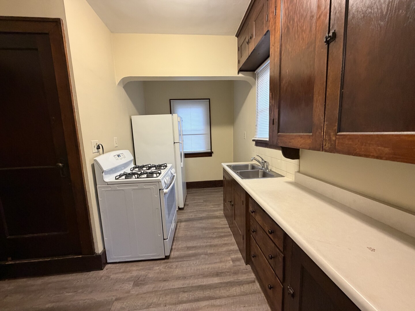 705 West Olive Street Bloomington, IL 61701 - Photo 7 of 32 a kitchen with a sink and an oven