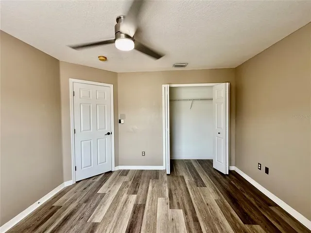 a bathroom with a double vanity sink toilet mirror and bathtub