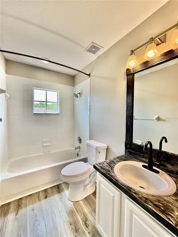 a room with a sink and cabinets