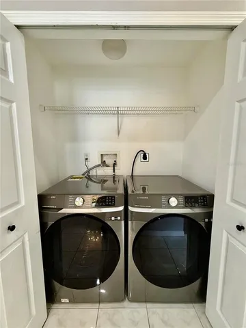 a view of a room with a ceiling fan