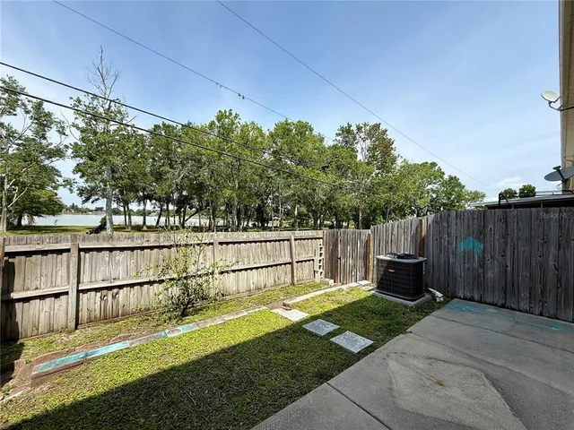a view of a backyard with a small cabin