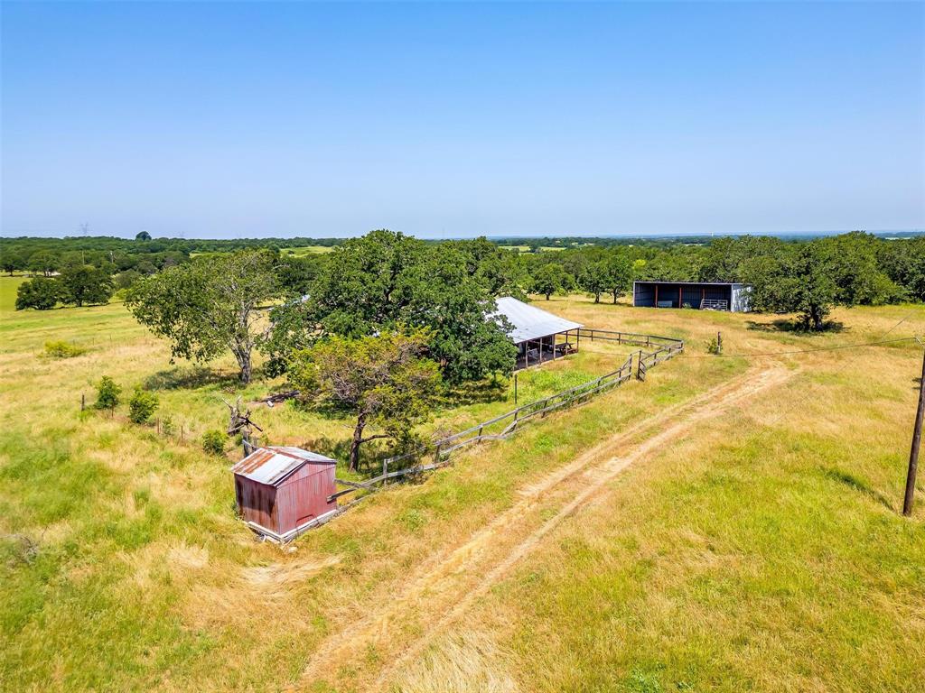 210 Trails End Poolville, TX 76487 - Photo 15 of 25 a view of a swimming pool with an ocean view