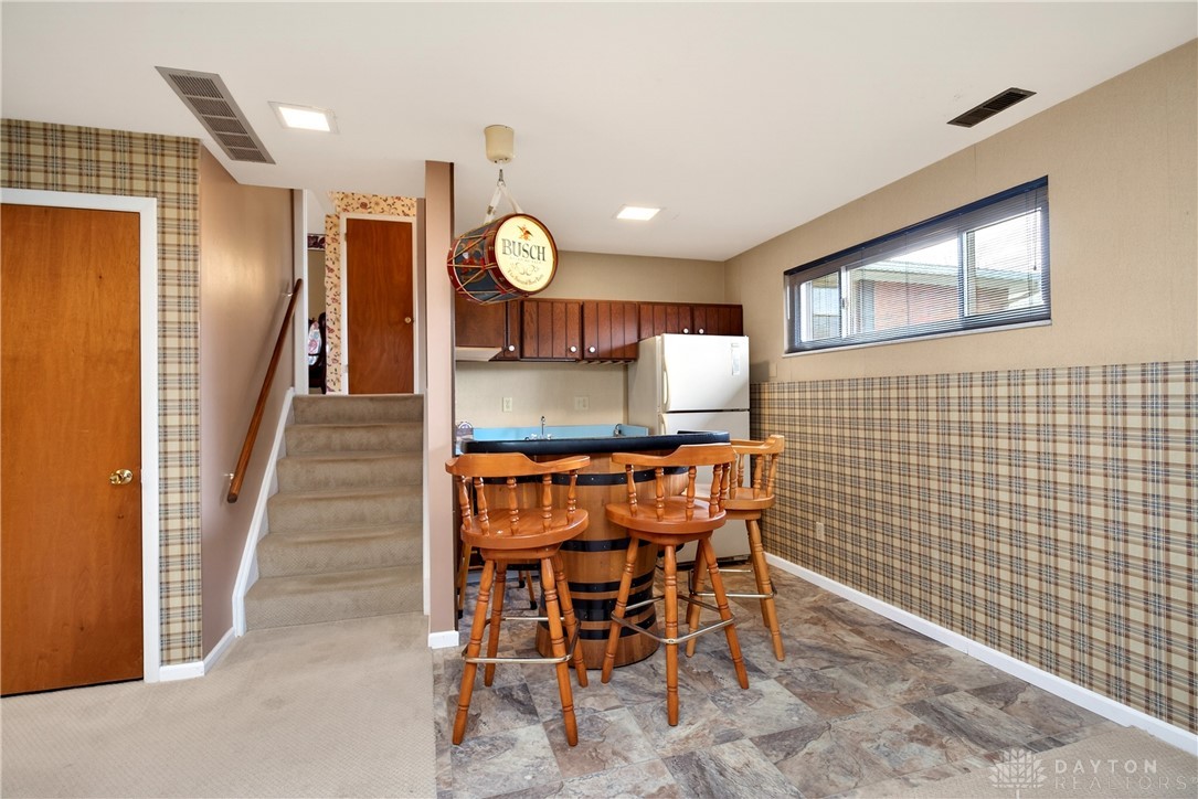 1547 Ambridge Road Centerville, OH 45459 - Photo 45 of 79 This versatile recreation area features a built-in wet bar and easy access to other living spaces.