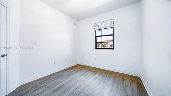 a bathroom with a toilet and a bathtub