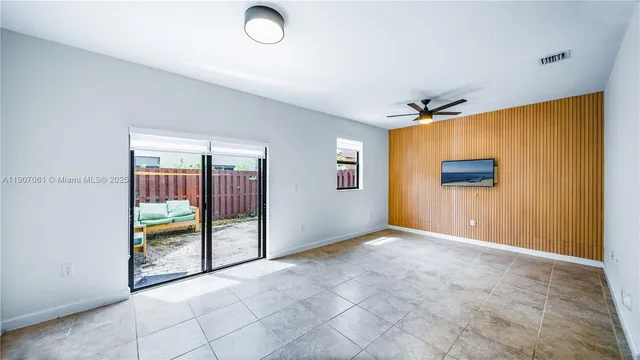 an empty room with window and furniture