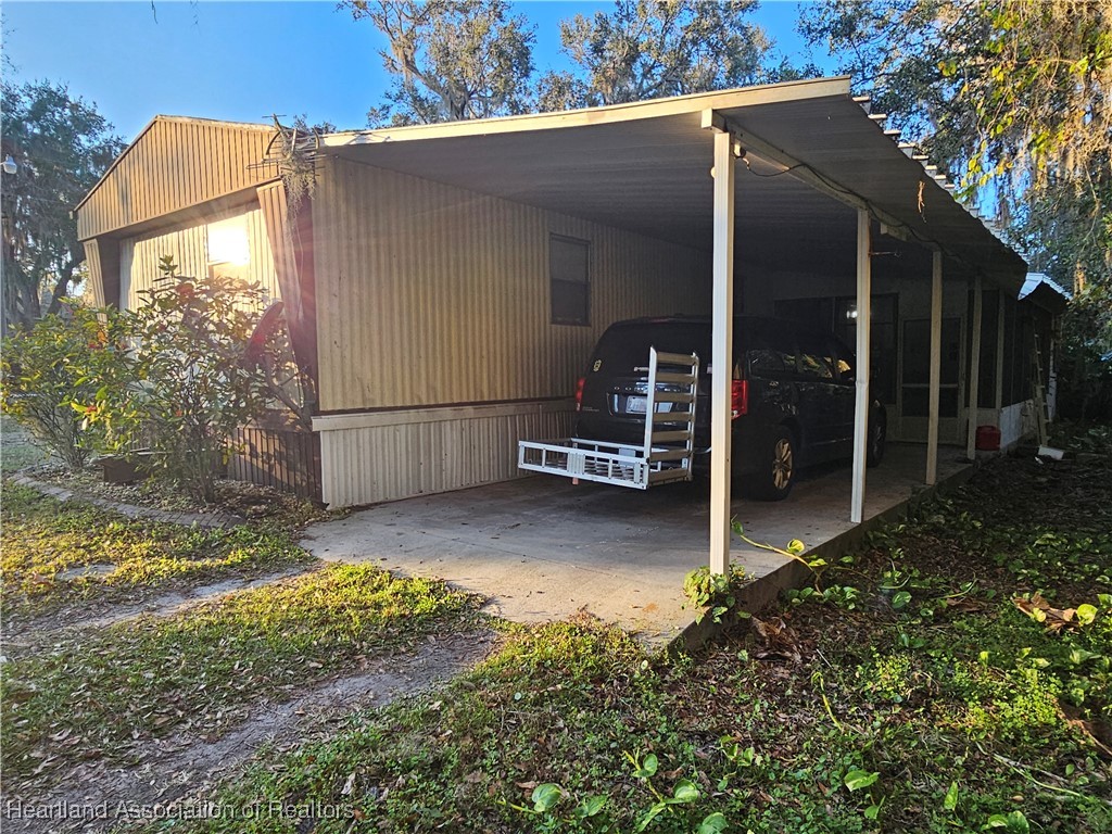 7959 Elliott Road Sebring, FL 33876 - Photo 2 of 31 a view of backyard with tub and seating space