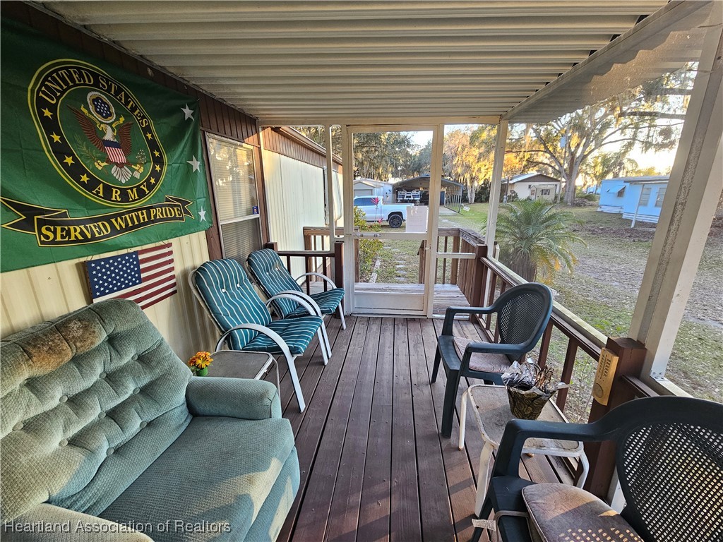 7959 Elliott Road Sebring, FL 33876 - Photo 28 of 31 a view of a chairs and table in patio