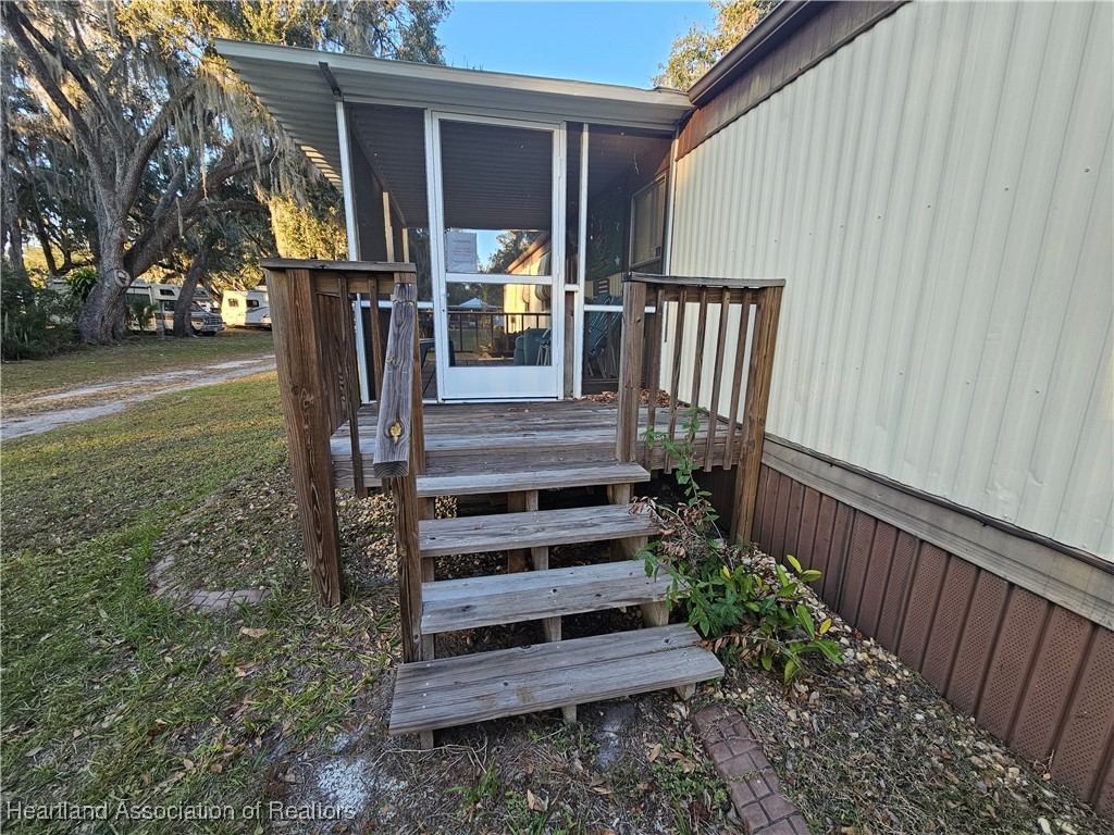 7959 Elliott Road Sebring, FL 33876 - Photo 3 of 31 a view of outdoor space with deck and patio