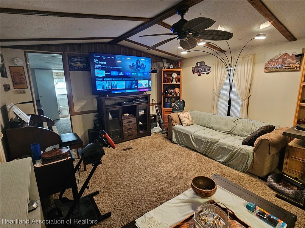 7959 Elliott Road Sebring, FL 33876 - Photo 6 of 31 a bedroom with furniture and a fan