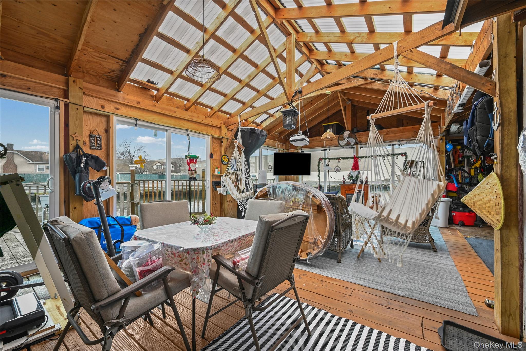 5 Chestnut Road Inwood, NY 11096 - Photo 16 of 20 a view of a dining room with furniture wooden floor and chandelier