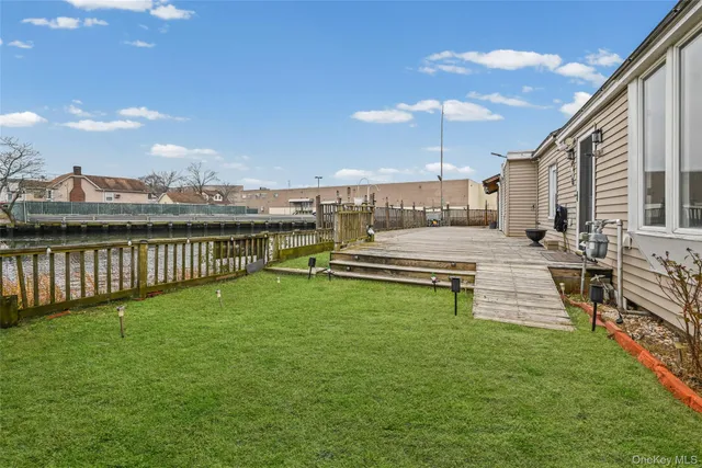 a view of a patio with a table and chairs