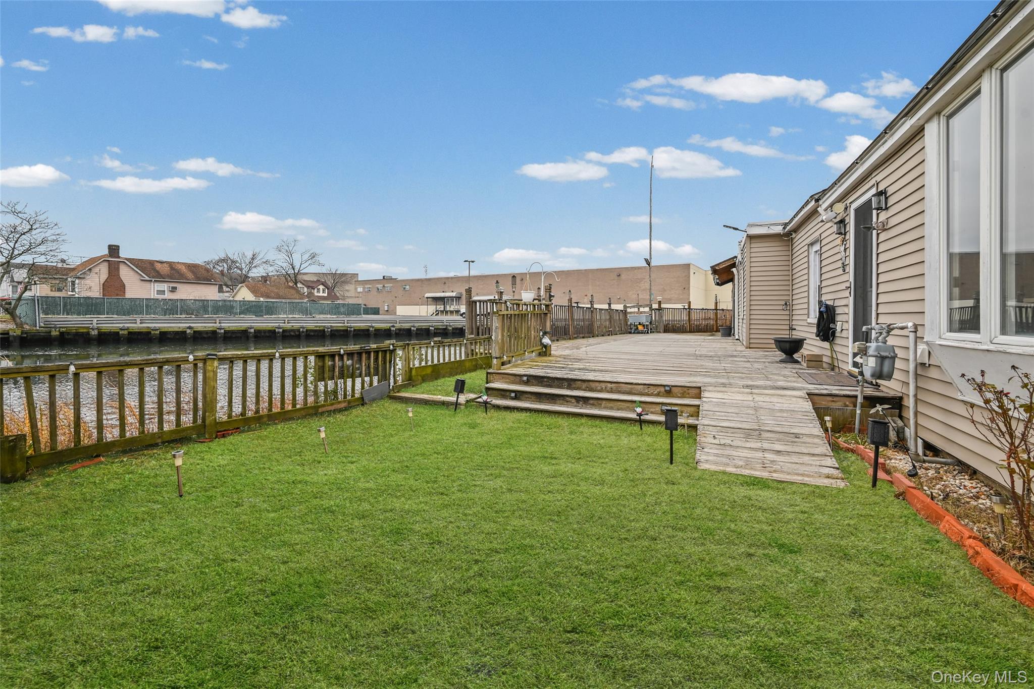 5 Chestnut Road Inwood, NY 11096 - Photo 18 of 20 a view of a patio with a table and chairs