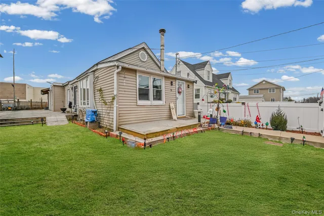 a front view of a house with garden and porch