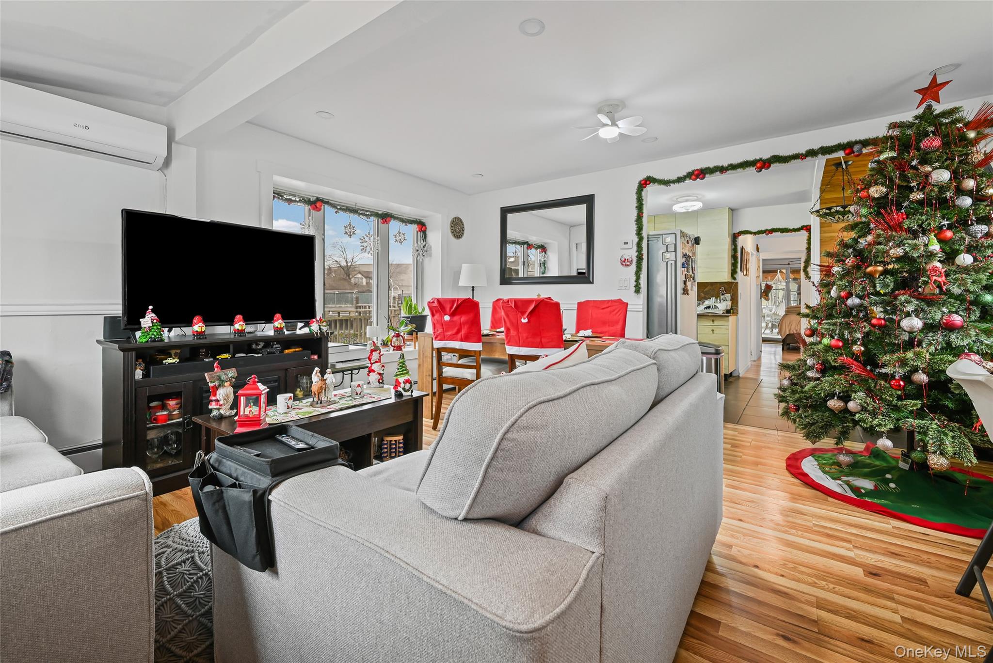 5 Chestnut Road Inwood, NY 11096 - Photo 9 of 20 a living room with furniture and a flat screen tv